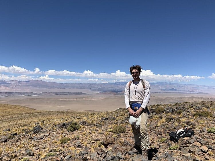 Photo of Mitchell on field work in the Andes